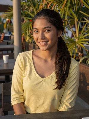 Maria, 24-year-old Filipina from Manila smiling outdoors - real dating profile for new users